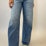 Pistola Sydney high rise jeans with bowed leg silhouette in light wash denim