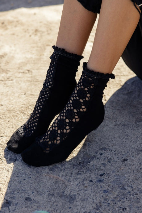 Free People black cotton crochet crew socks with ruffle trim and soft textured panel