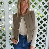 Women’s reversible fall vest with quilted nylon and cozy faux shearling