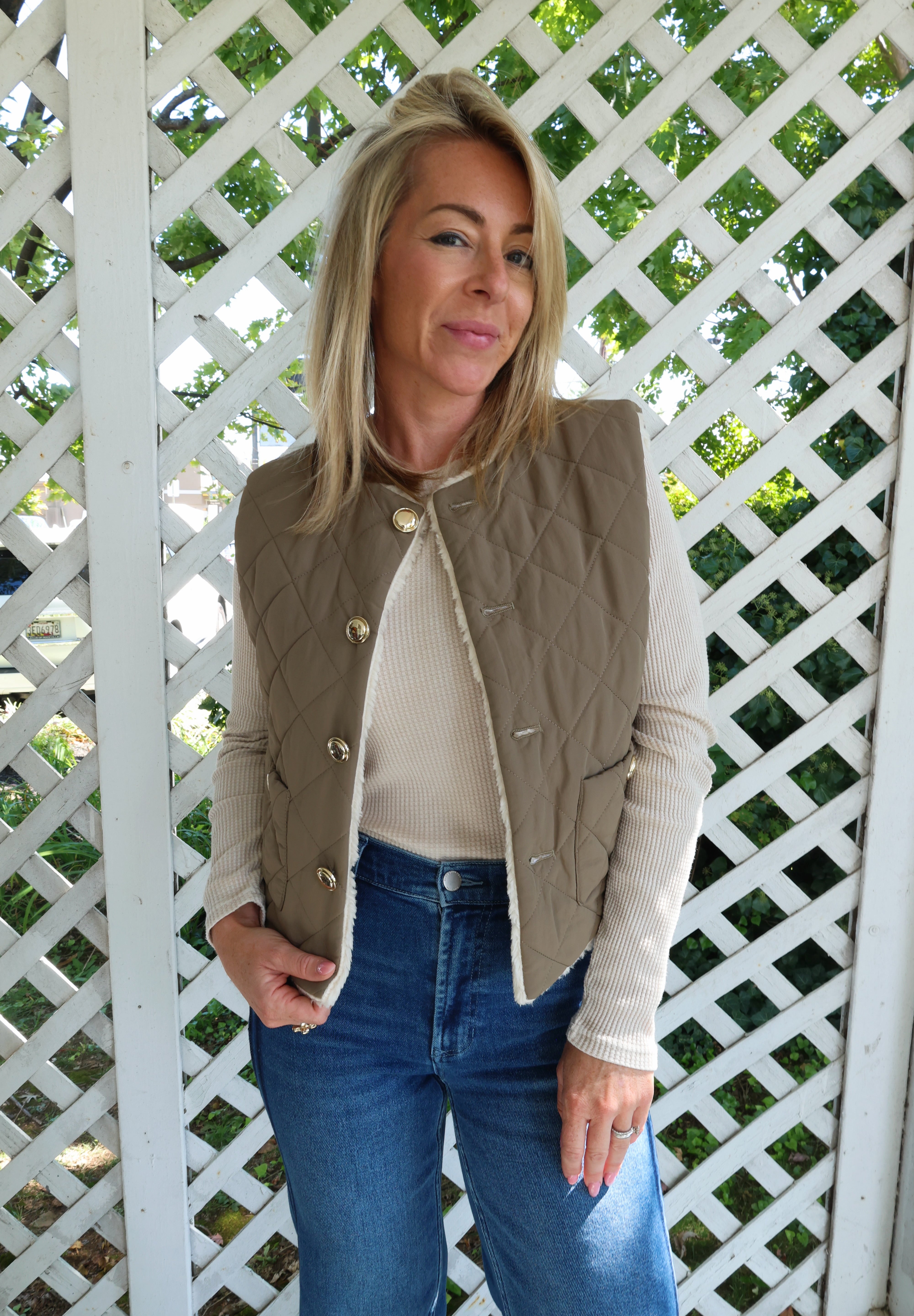Women’s reversible fall vest with quilted nylon and cozy faux shearling