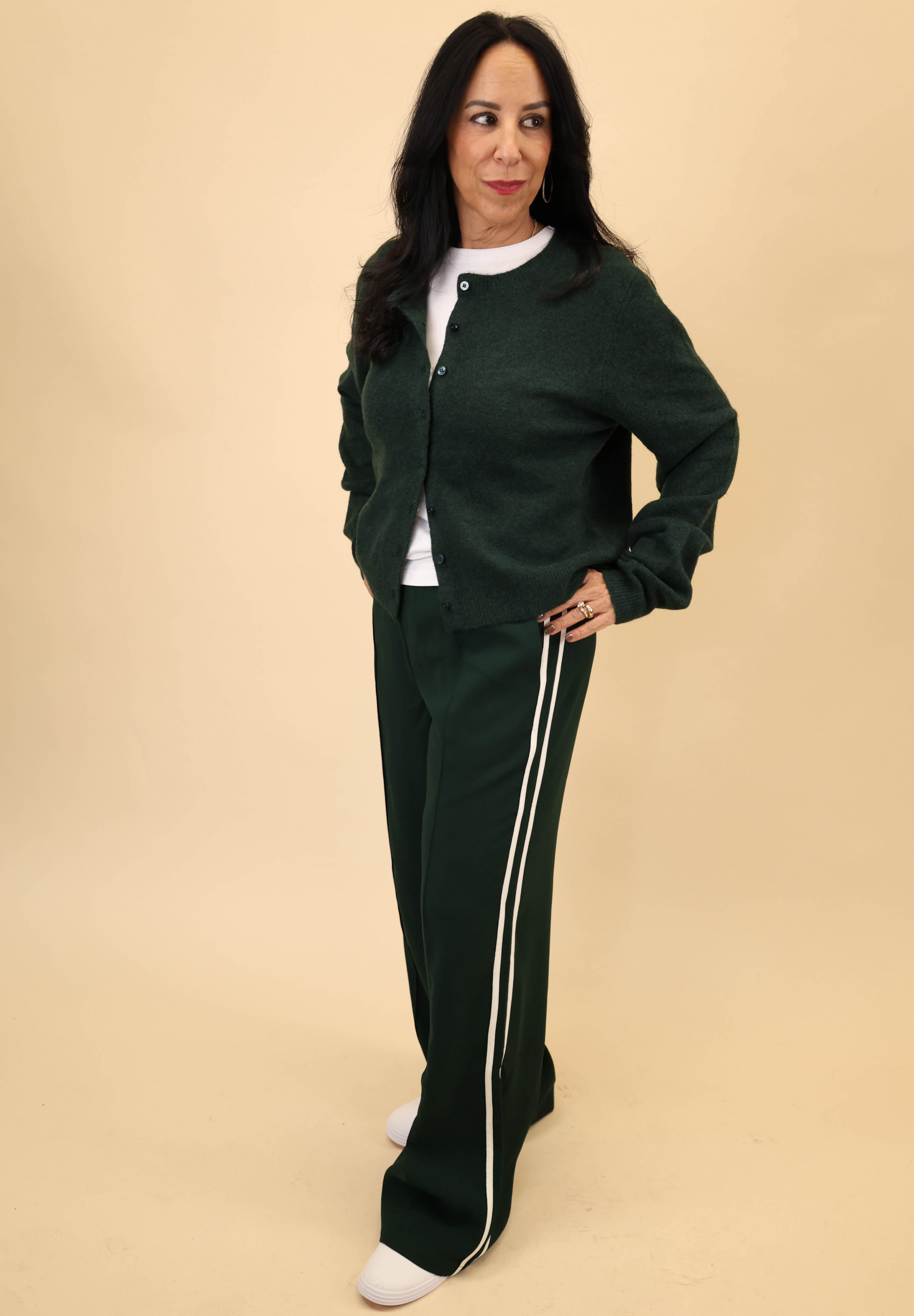 Z Supply Saunder Track Pant in soft green featuring a high-rise silhouette, wide legs, and white seam stripes.