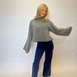 Grey Dèluc Cropped Turtleneck Sweater featuring a cozy structured knit and timeless sophistication for any occasion.
