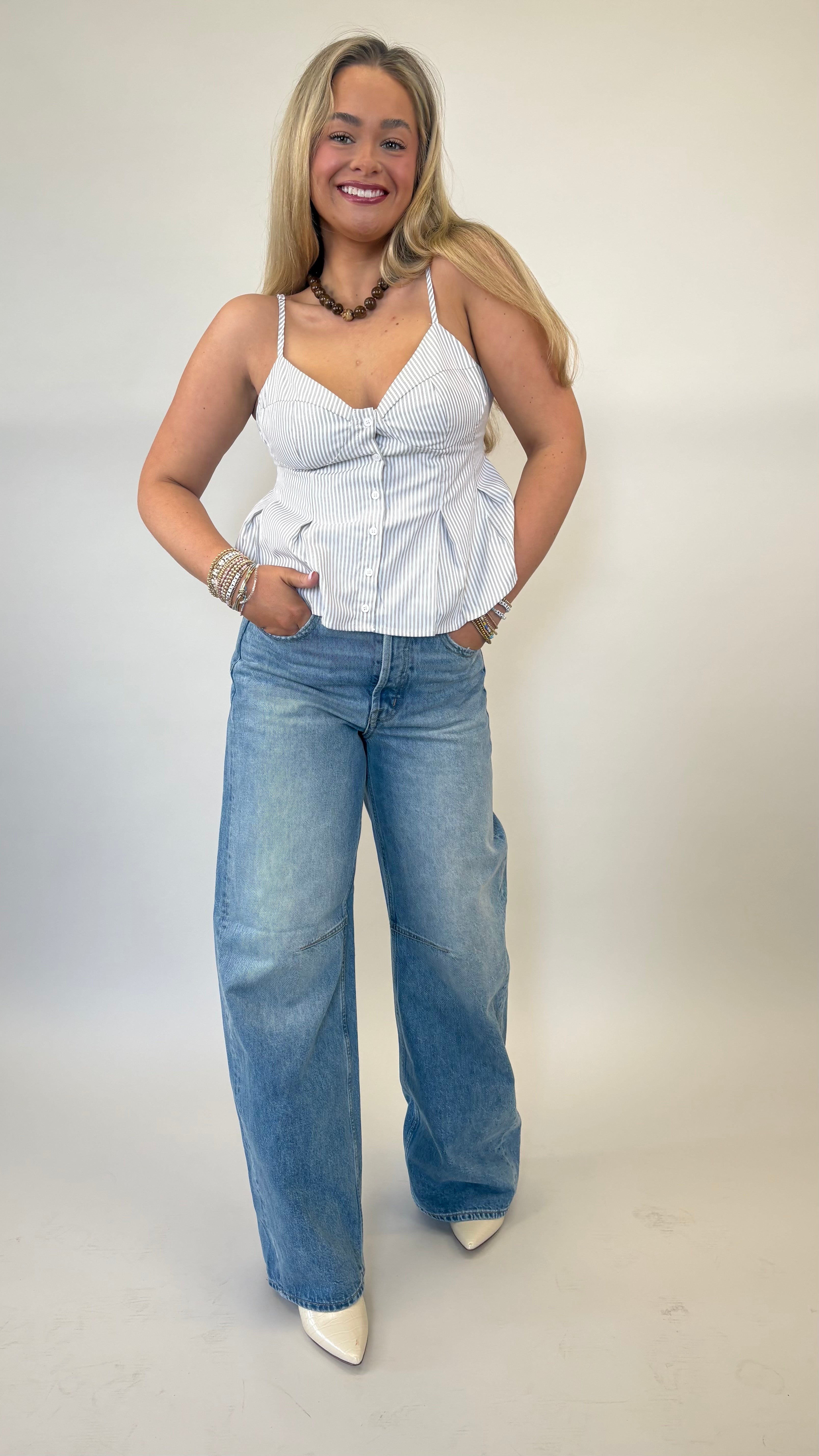 Olive and cream Deluc Corvo top featuring adjustable straps and peplum silhouette
