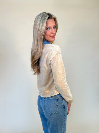 Back of denim collar washed polo women's top from shear boutique. Paired with blue jeans 