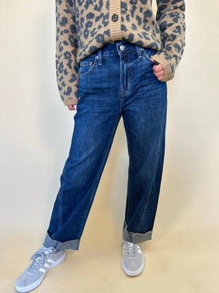 woman posing wearing kacey mid rise cuffed boyfriend jeans shear boutique