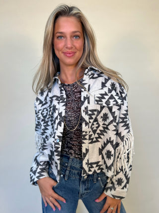 fringe aztec shacket worn open with black top underneath 