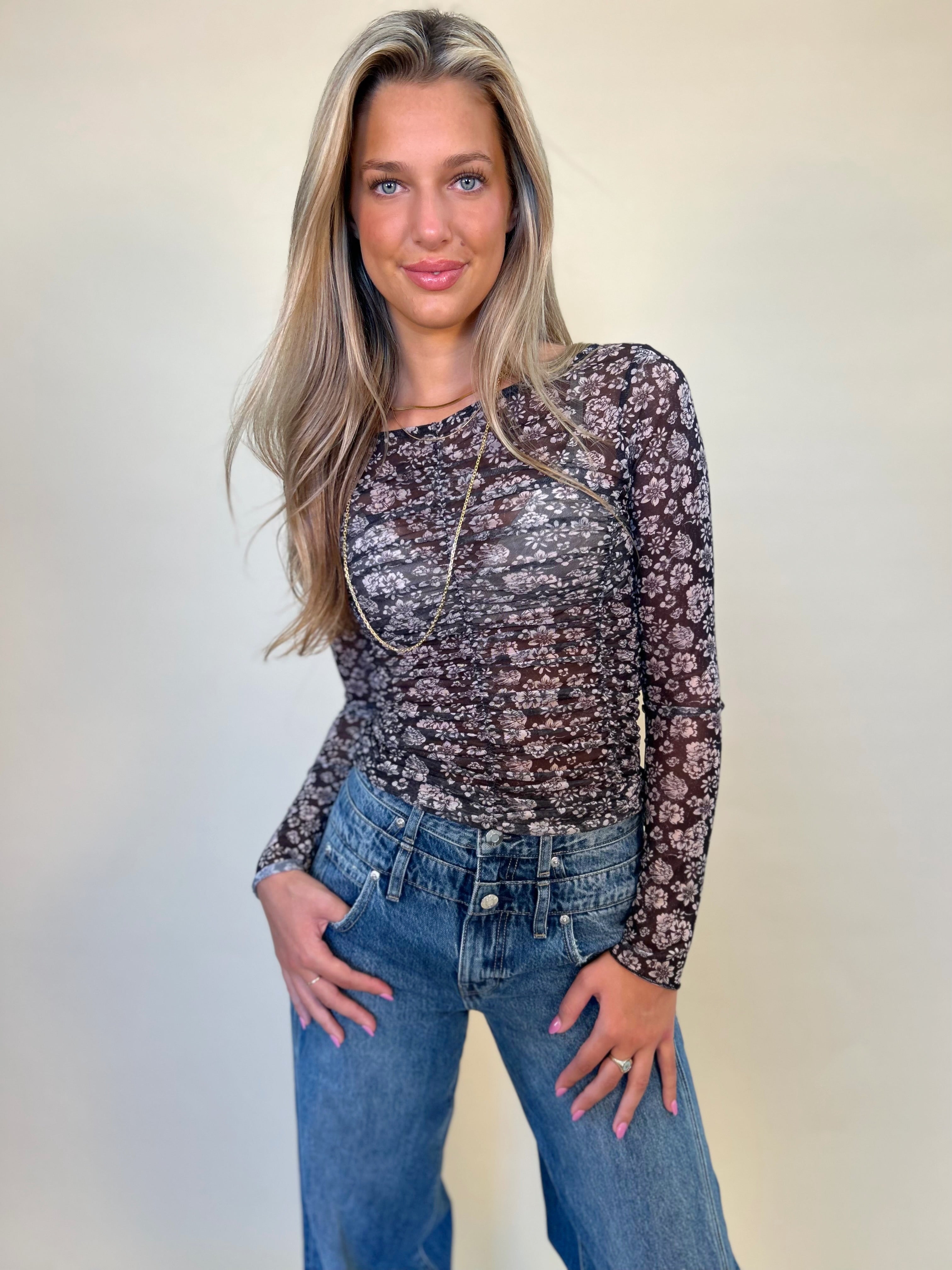 Mystree Mesh print  floral lettuce hem top paired with caleb double button denim. Women's long sleeve top shear boutique fall collection 