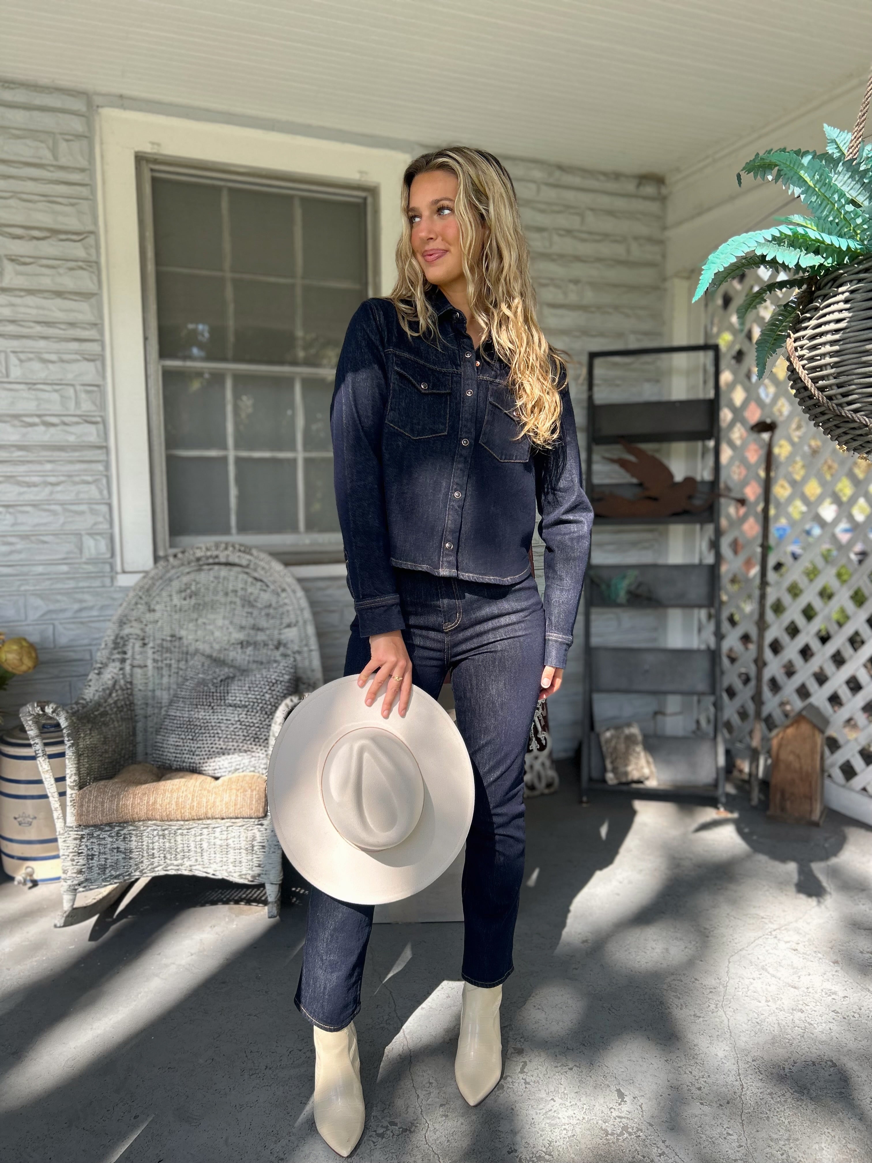 Thea Denim Shirt featuring two front pockets and a tailored fit — a versatile piece to wear solo or layered for effortless style.