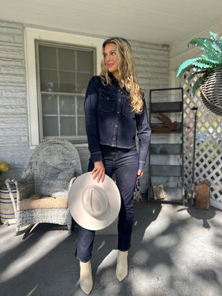 Thea Denim Shirt featuring two front pockets and a tailored fit — a versatile piece to wear solo or layered for effortless style.
