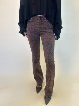 close-up of dear john jaxtyn slim boot cut brown leopard denim women's jeans from shear boutique.