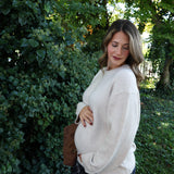 Soft relaxed-fit knit sweater for women styled with trousers for an elevated casual outfit at Shear Boutique