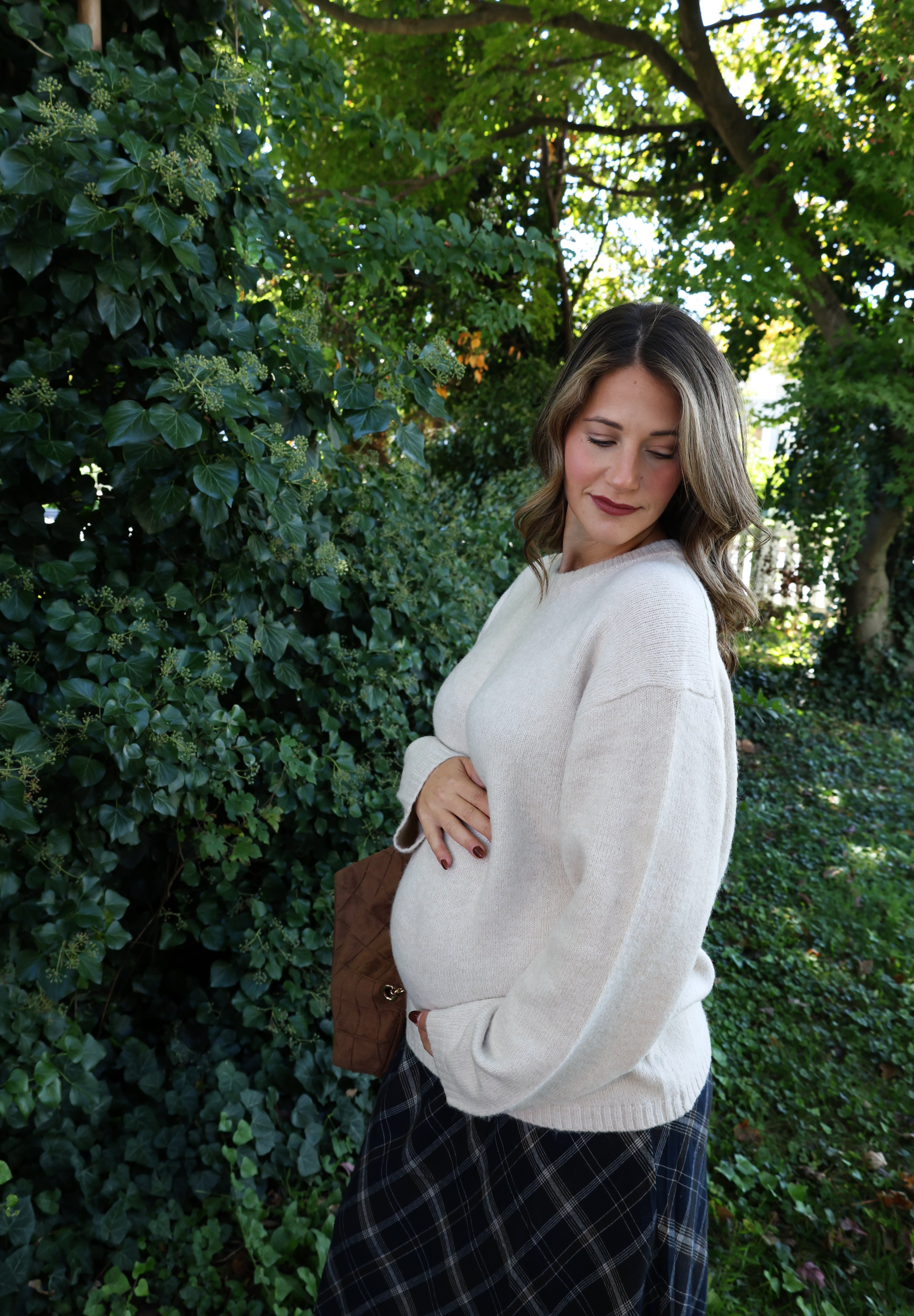 Soft relaxed-fit knit sweater for women styled with trousers for an elevated casual outfit at Shear Boutique