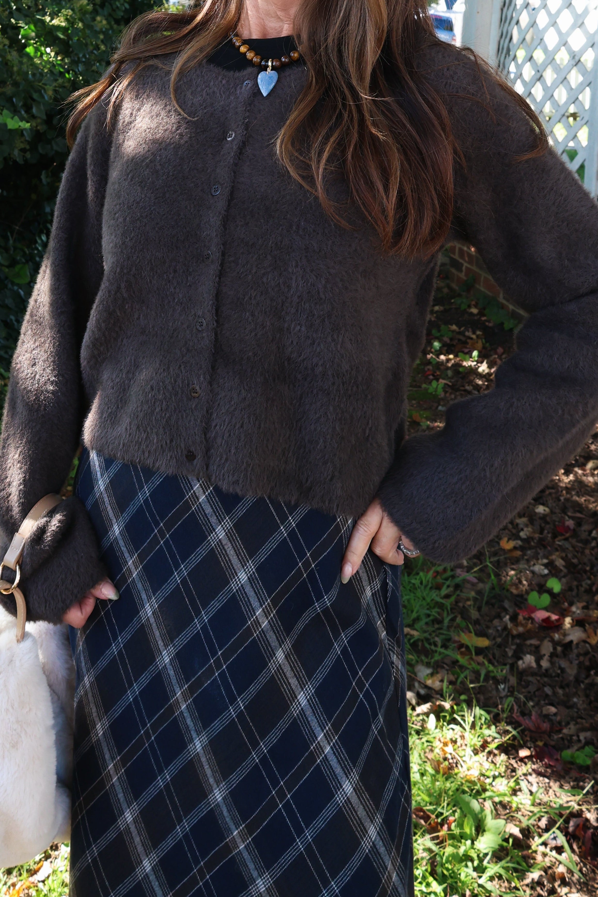 Cozy fluffy knit cardigan for women styled as a fall and winter layering piece at Shear Boutique Olney