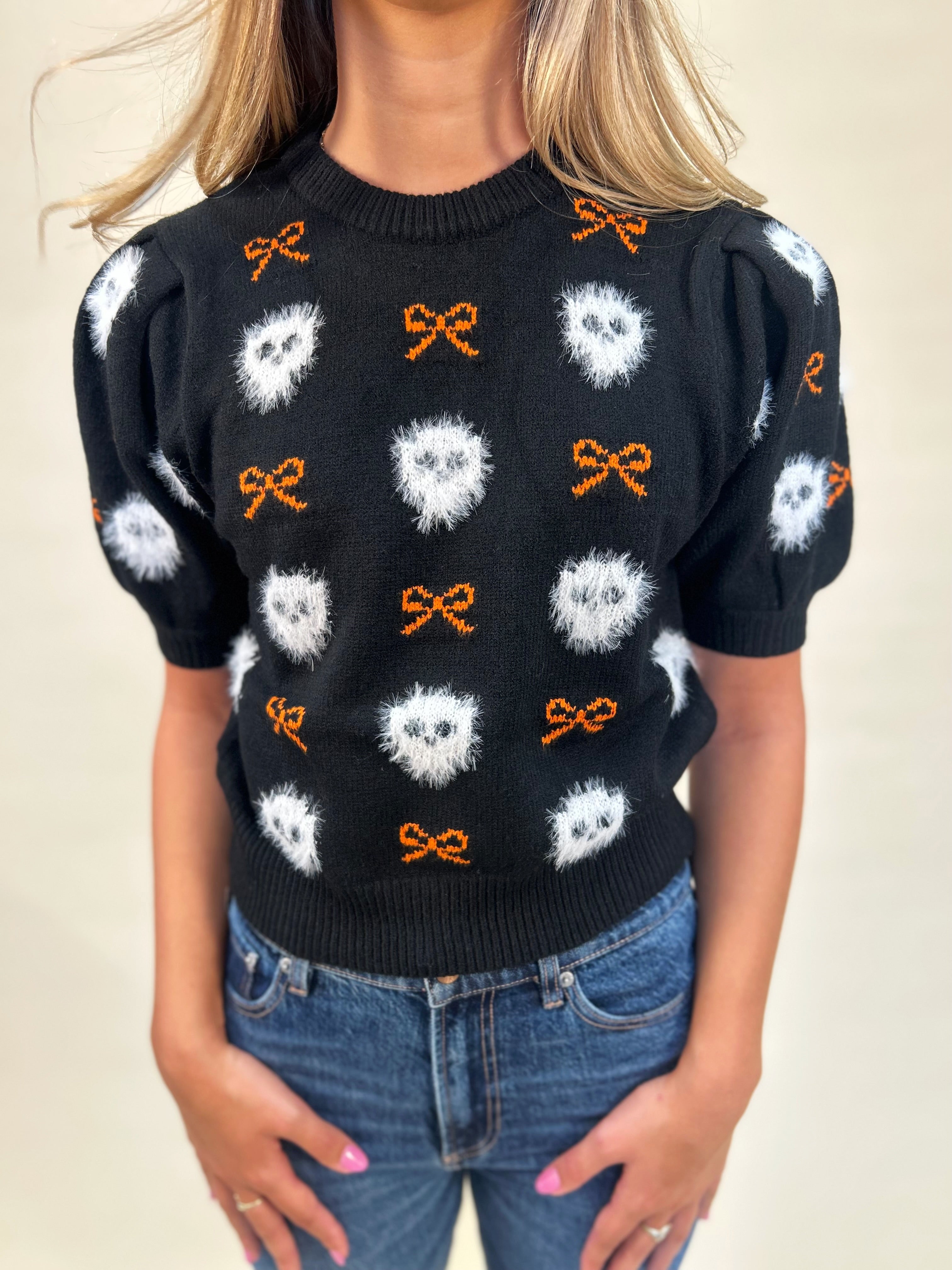 Cute and festive Peach Love Boo Bow Sweater — relaxed fit short sleeve knit, perfect for spooky season style.