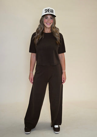 Model wearing matching Kori Elbow Sleeve Crewneck Sweater and Kori Pant in Dark Espresso, full outfit front view.