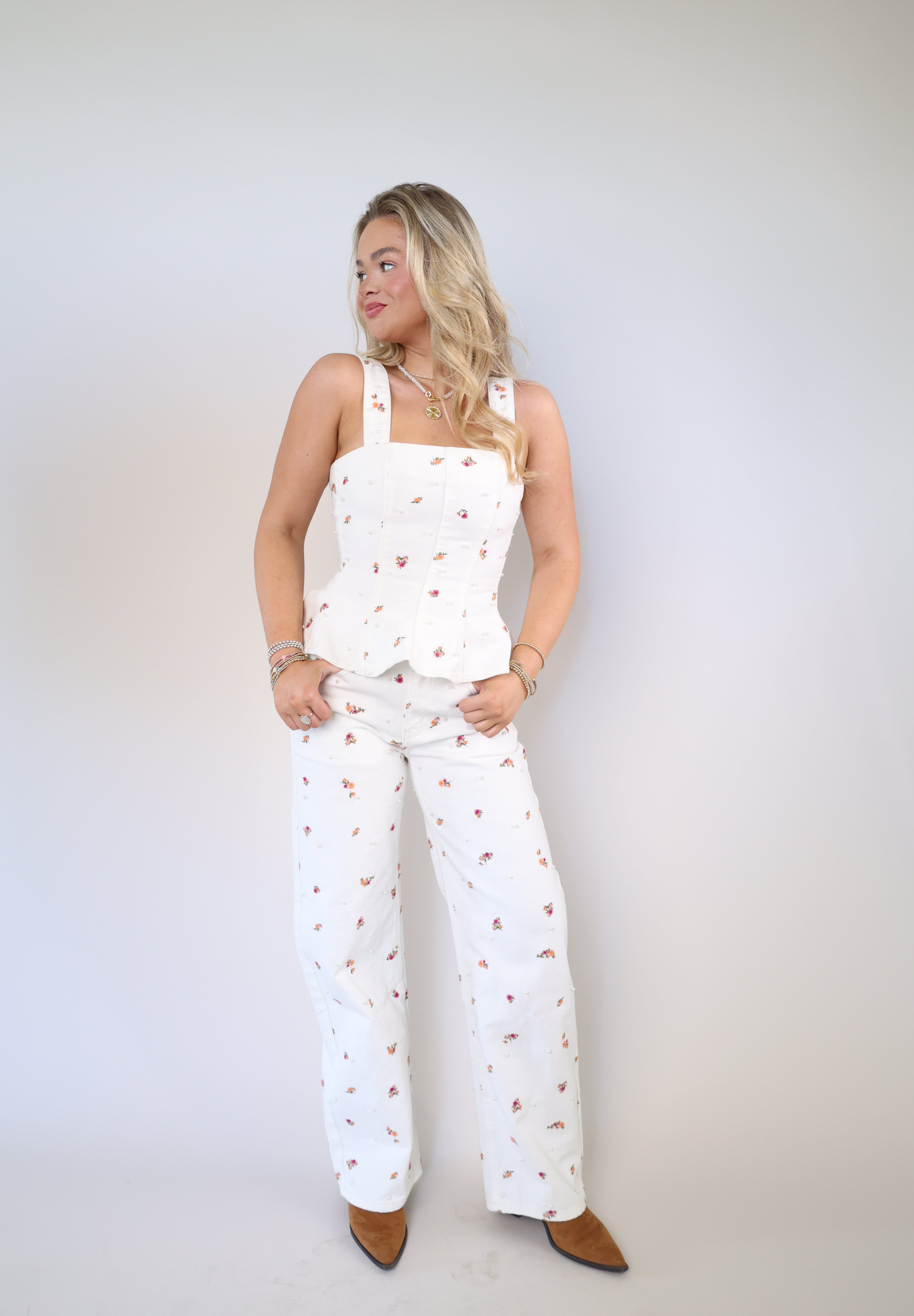 Wide-leg denim jeans with allover floral print and vintage-inspired wash