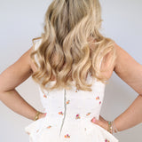 Women’s embroidered denim top with ruffle hem designed as matching set piece