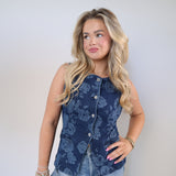 Structured sleeveless denim top with soft floral print and button front