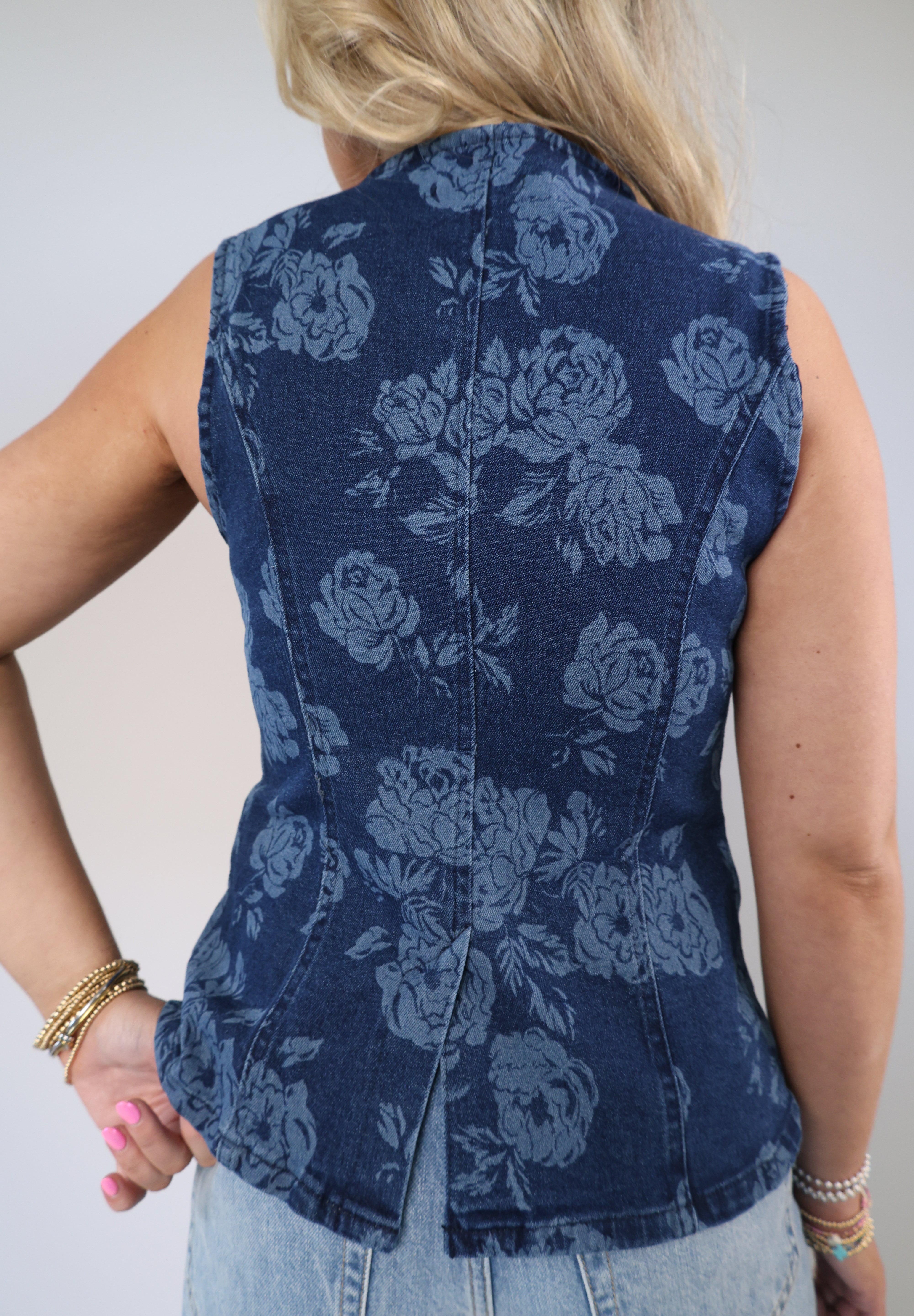 Floral denim vest-style top with tailored silhouette and sleeveless cut