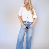 Breathable linen blend top with front bow details and v-neckline for effortless warm weather styling