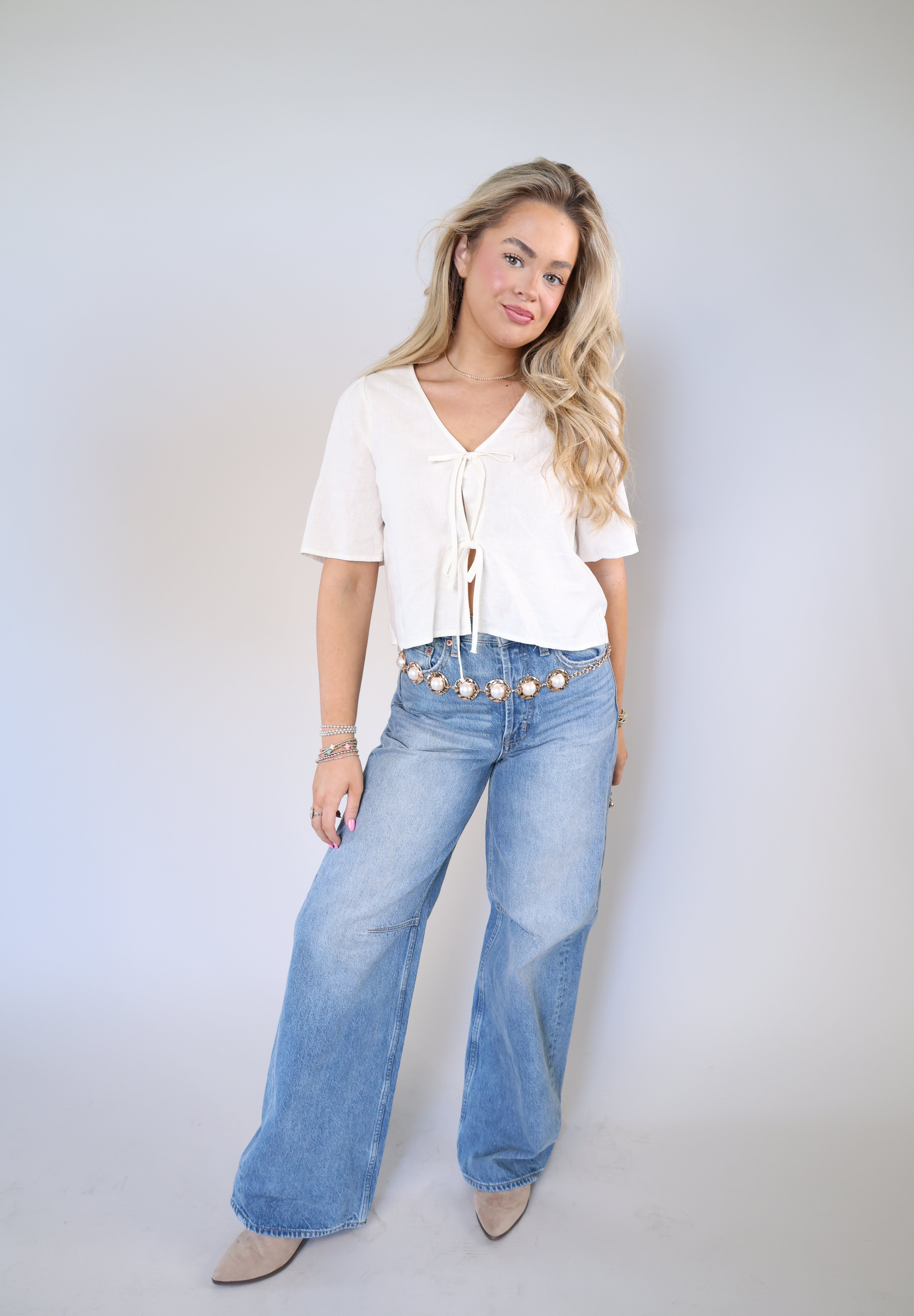 Women’s washed linen blend blouse with v-neck and bow tie front, lightweight spring top