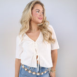 La Belle linen tie-front top with bow details styled with Sydney high rise bowed leg jeans and pearl gold chain belt