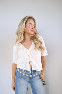 La Belle linen tie-front top with bow details styled with Sydney high rise bowed leg jeans and pearl gold chain belt
