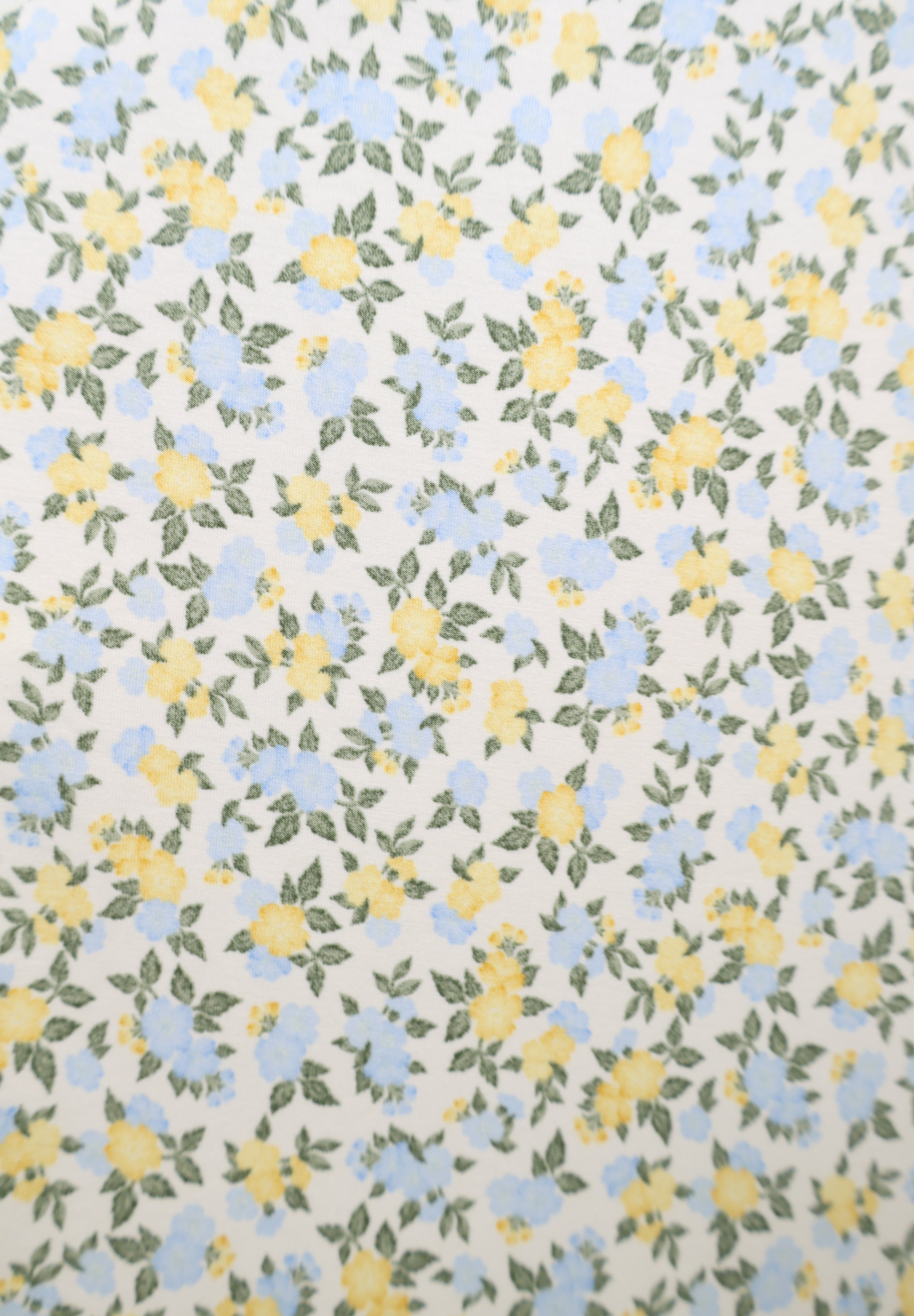 Feminine floral v-neck maxi dress with adjustable straps and flowy silhouette