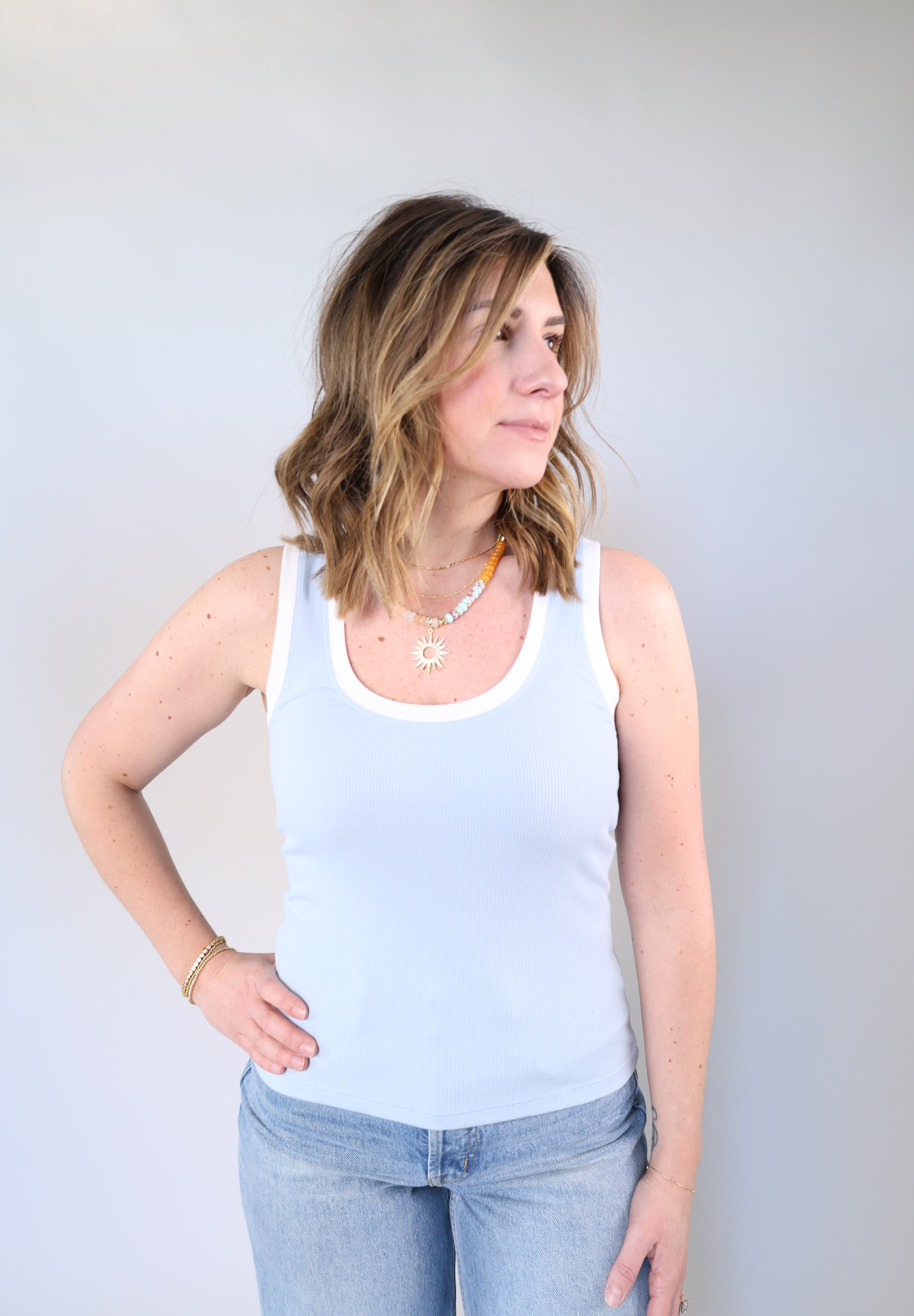 Women’s light blue ribbed scoop neck tank with white trim and bra-friendly wide straps