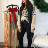 Woman styled in green Show Me The Way scarf draped over shoulders, emphasizing warmth and oversized design.