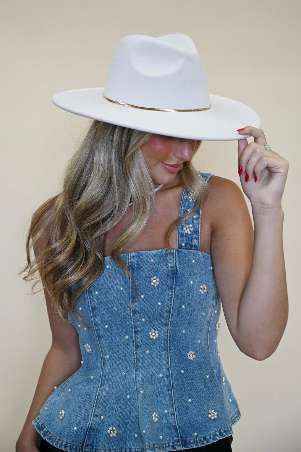 Fiorella Top from Steve Madden: denim peplum tank top/ corset top with pearl floral embellishments front view worn with white cowboy hat. Shear boutique fall collection women's tops