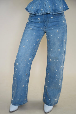 Close-up detail of Steve Madden Fianna Embellished Barrel Jeans with pearl and rhinestone embellishments on light wash denim