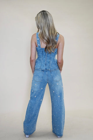 Back view of model in Steve Madden Fiorella Embellished Denim Top and Fianna Embellished Barrel Jeans, showing fit and detailing