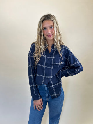 Z Supply River Plaid Shirt in soft-washed blue and white plaid, designed with a classic collar, long sleeves, button-down front, and a single chest pocket for a timeless look.
