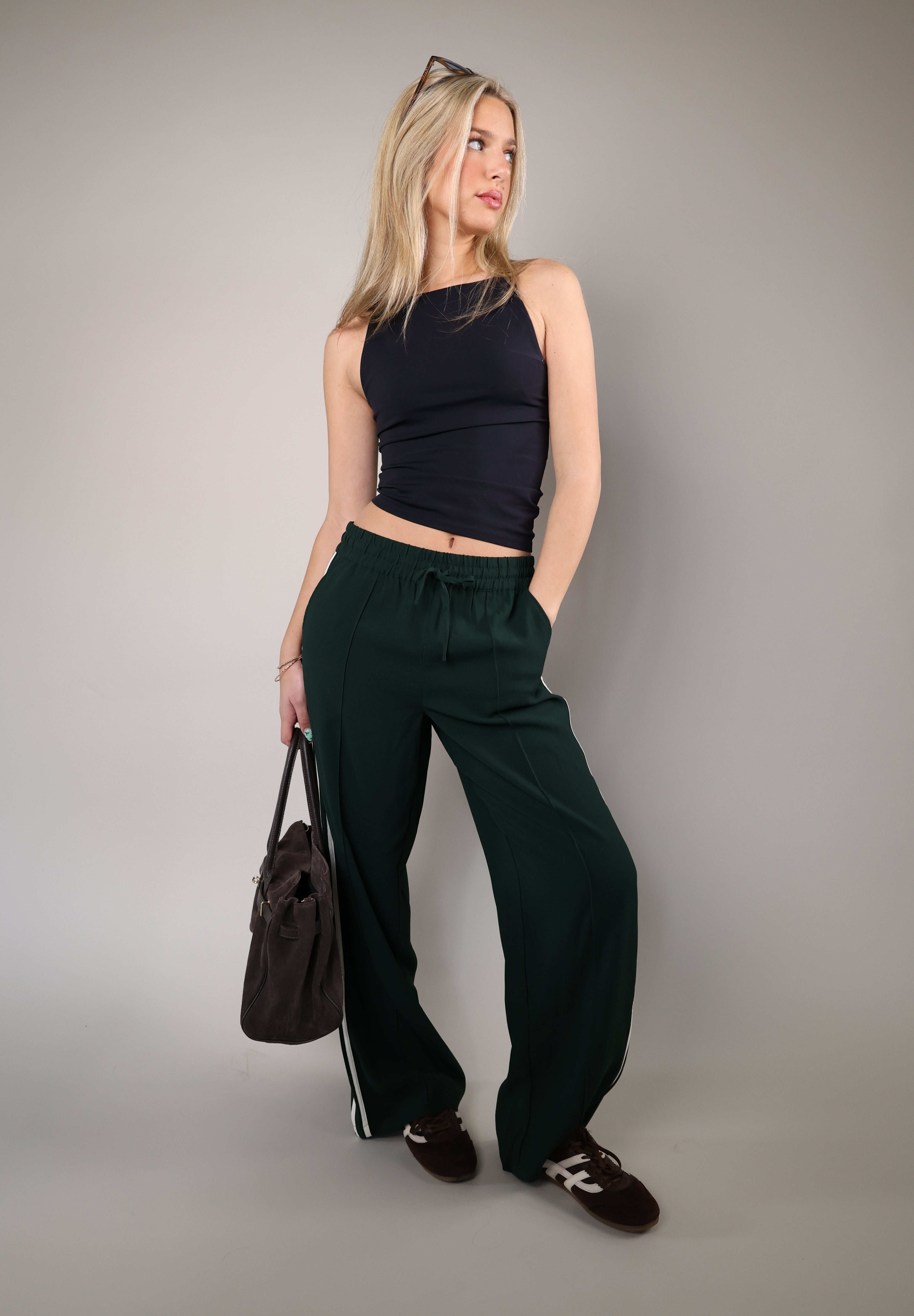 Comfortable Z Supply Saunder track pant made from light, flowy fabric with a wide leg, full-length fit, elastic waistband, and slash pockets.
