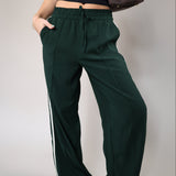 Lightweight Z Supply Saunder track pants designed with a flowy wide leg, full length cut, elastic waistband, and slash pocket detailing.