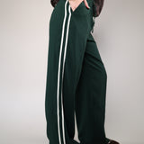 Z Supply Saunder flowy track pant with a wide leg design, full-length styling, elastic waistband, and functional slash pockets.