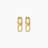 Gorjana Put a Charm On It Huggies — 18k gold-plated earrings with a 13/16” drop, surgical steel post, and hinge closure for a sleek, everyday look.