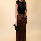 Brown high-waisted wide-leg pants made from soft, silky material by DeLuc.