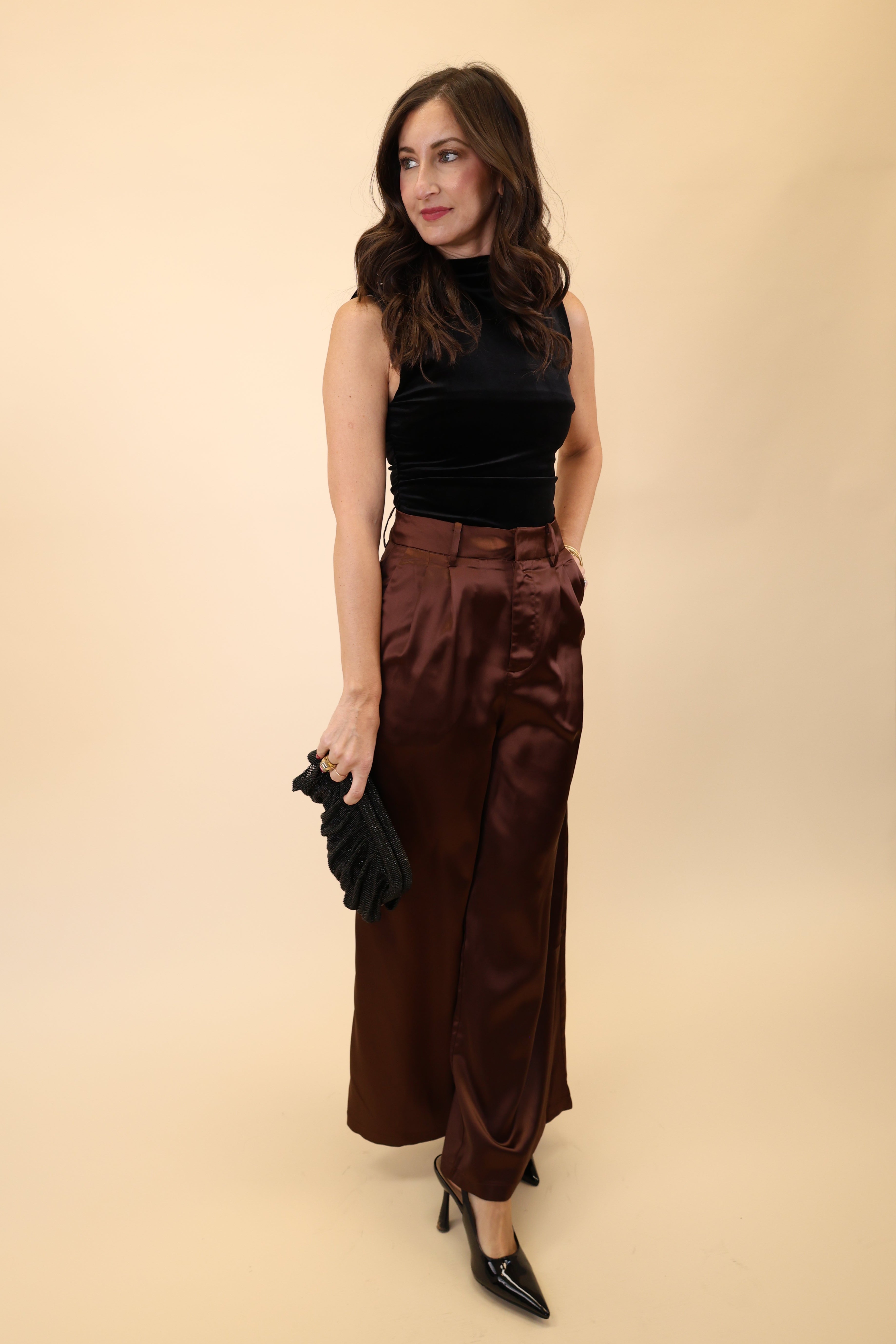 Brown high-waisted wide-leg pants made from soft, silky material by DeLuc.