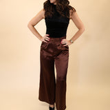 DeLuc Otto Pants in silky brown fabric with a high-waisted, wide-leg silhouette.
