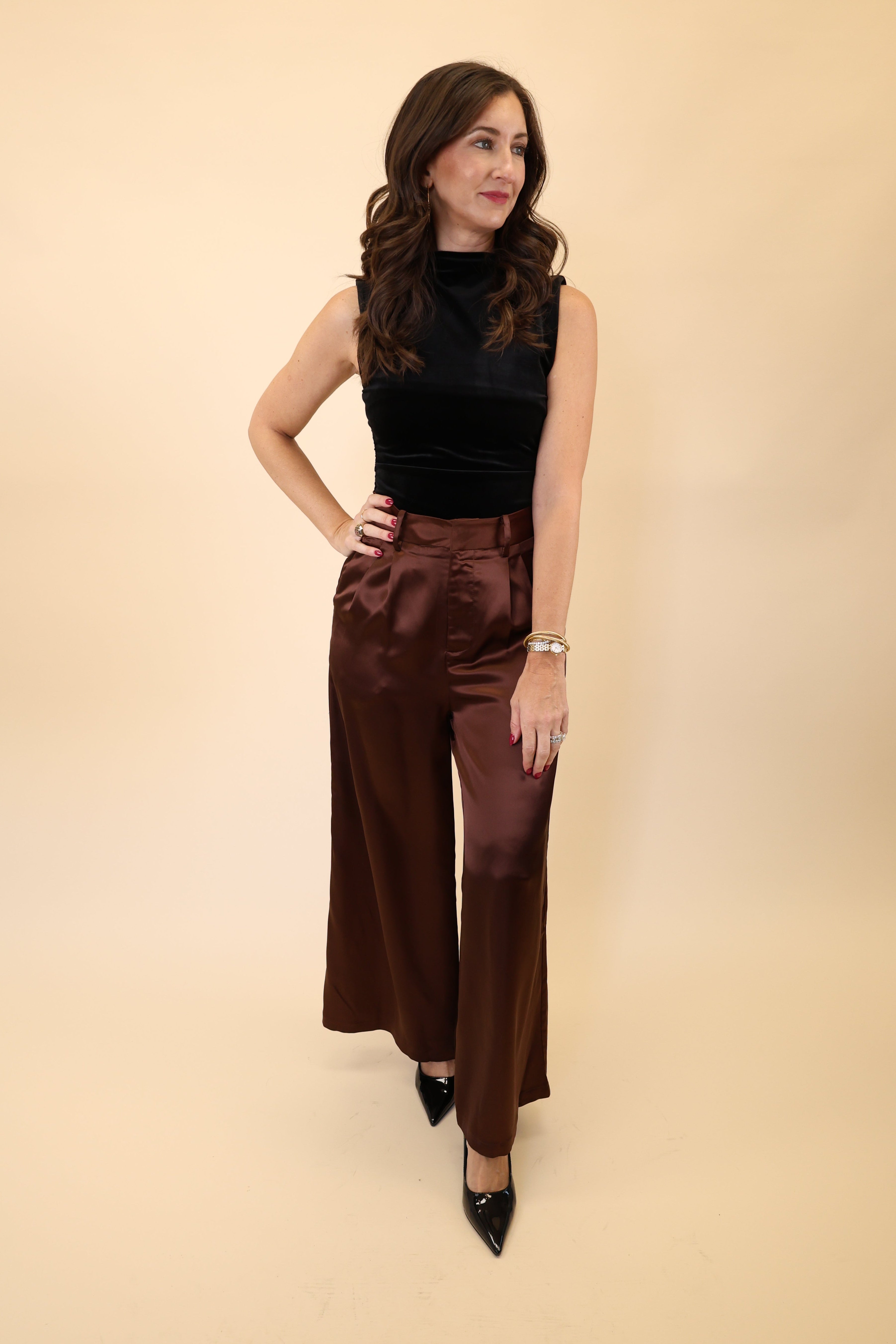 High-waisted, wide leg Brown pants with a luxurious silky finish from DeLuc. 