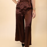 DeLuc Otto wide-leg pants in smooth brown fabric with a high-rise fit.