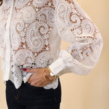 Lightweight white lace top by Dear John with intricate eyelet accents and a cropped fit.