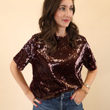 Brown short-sleeve top featuring shimmering details by DeLuc.