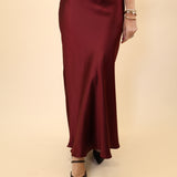 Steve Madden Jeannie Maxi Skirt in silky red fabric with a flowing silhouette.