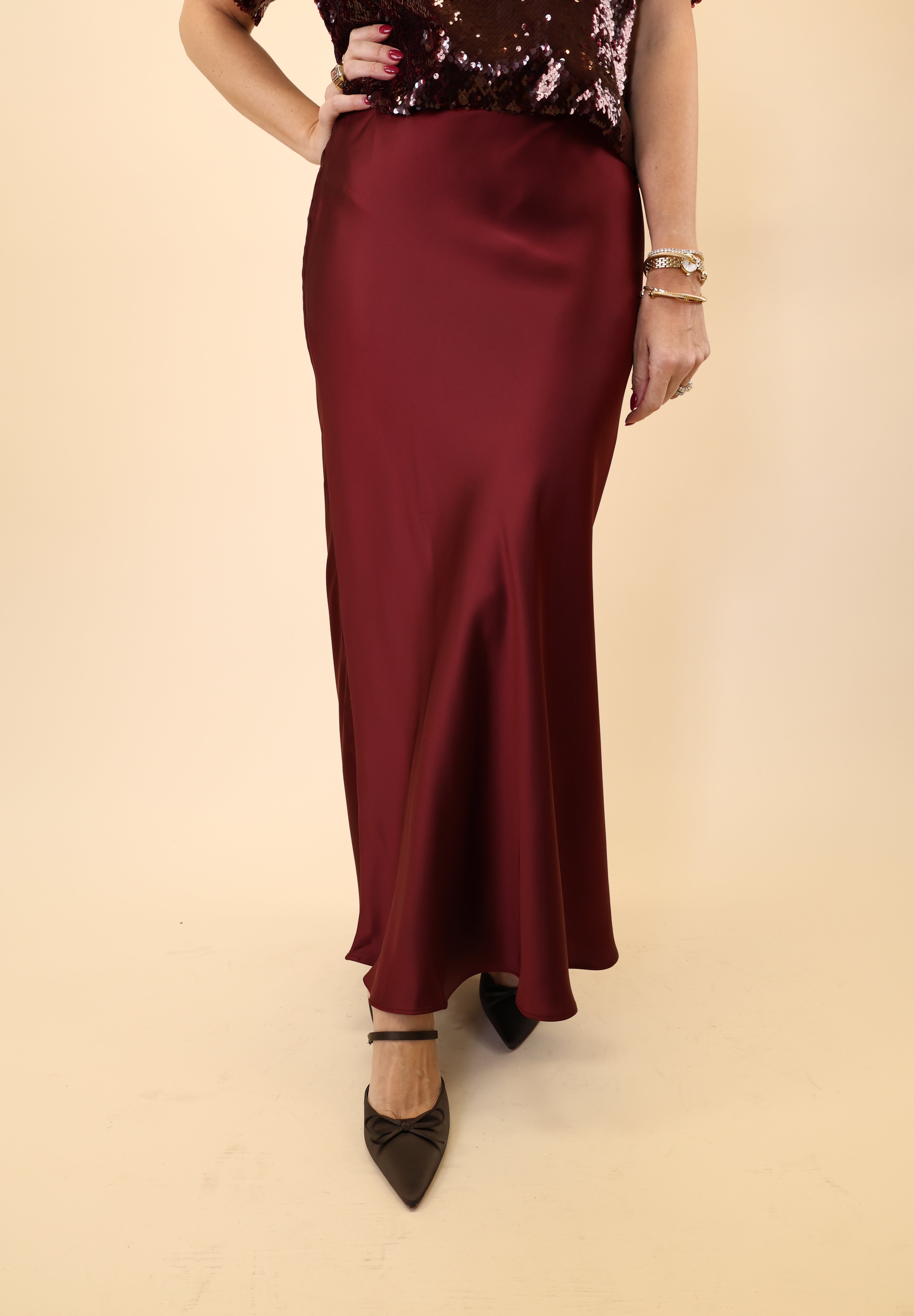 Steve Madden Jeannie Maxi Skirt in silky red fabric with a flowing silhouette.