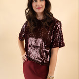 DeLuc short-sleeve top in brown fabric with glittery accents.
