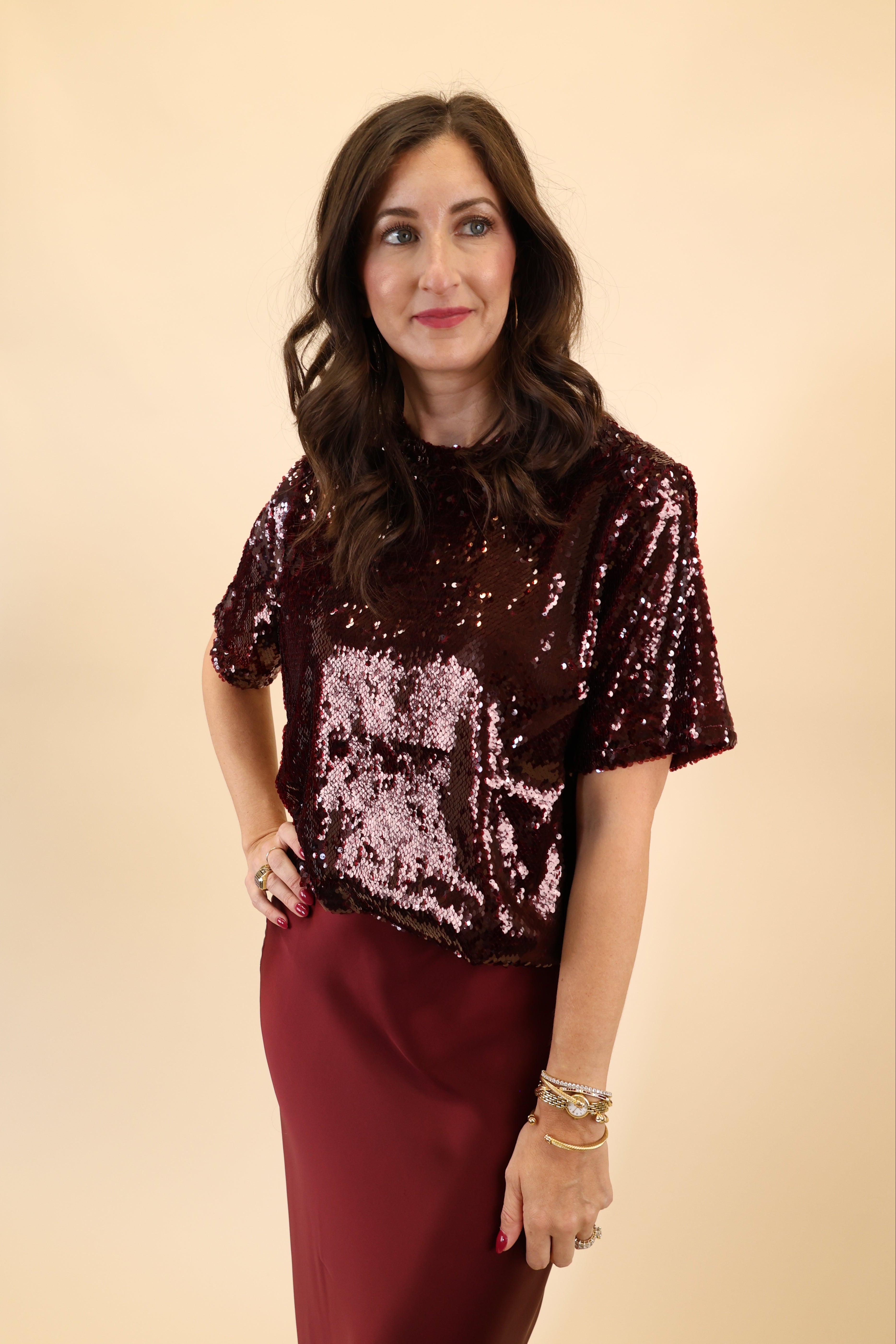 DeLuc short-sleeve top in brown fabric with glittery accents.