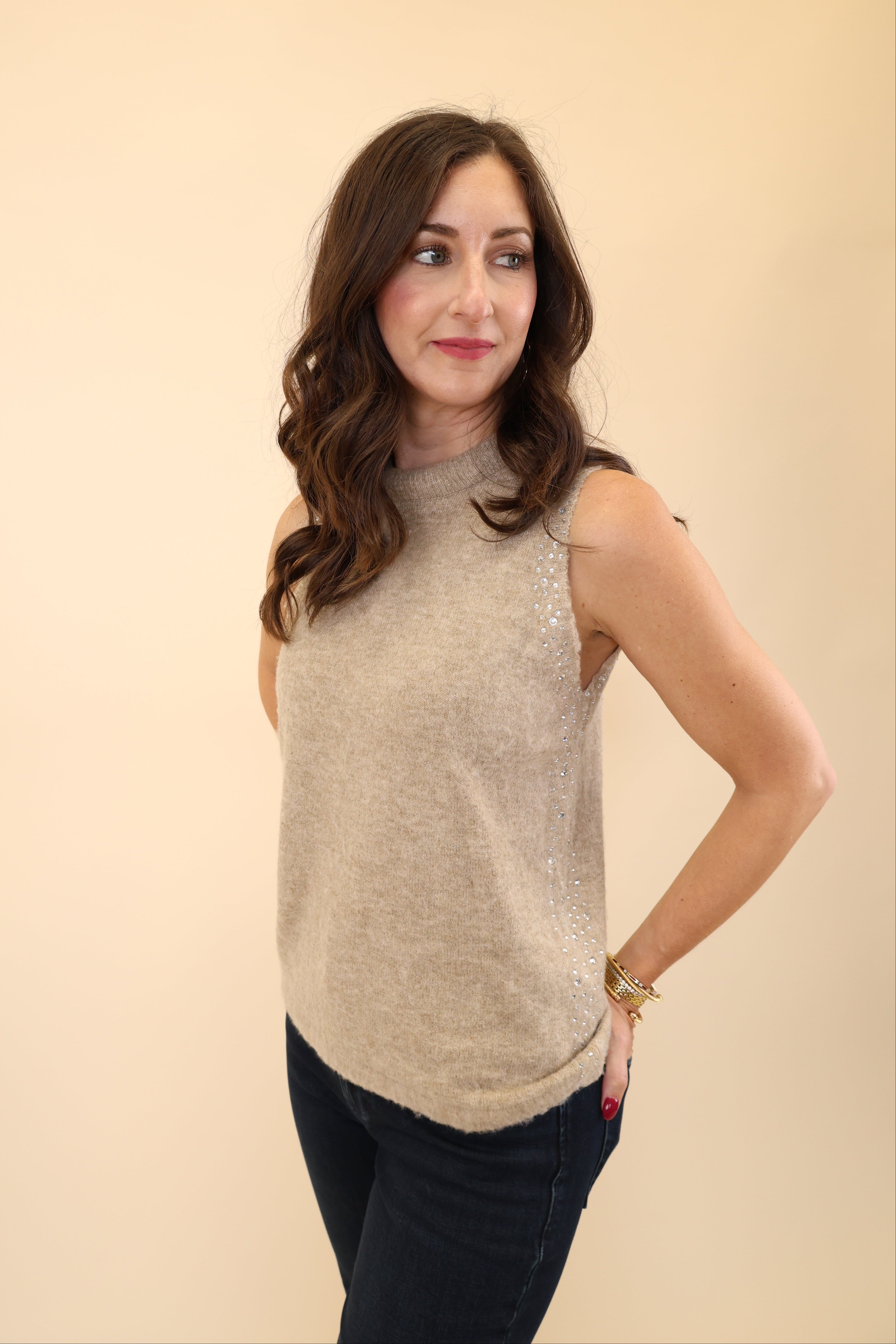 DeLuc Myles Knit Vest in soft beige fabric with a fuzzy texture, rhinestone embellishments, and a crew neckline.